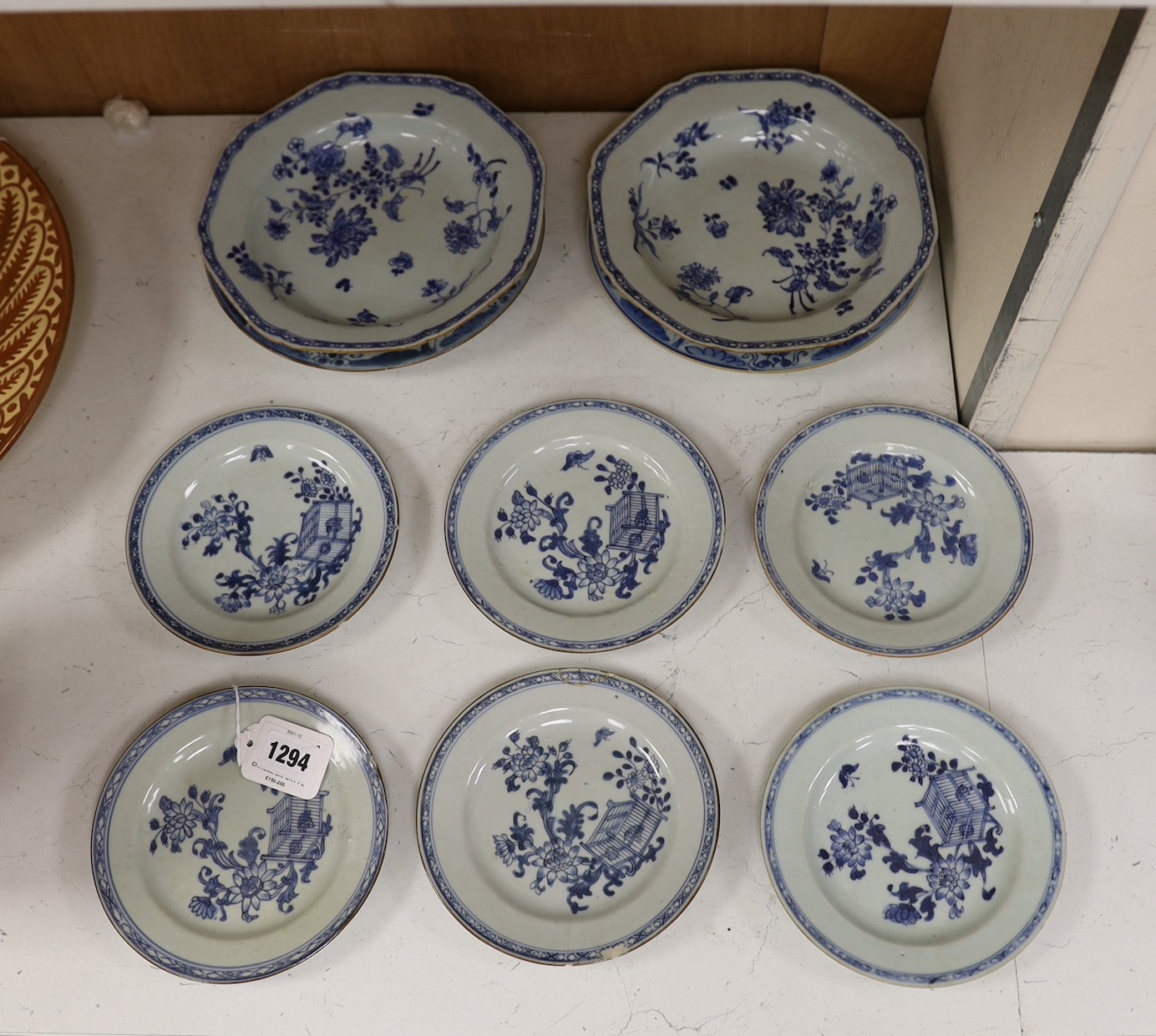 A Set of six 18th century Chinese export blue and white ‘bird in a cage’ small plates, 6.3 cm diameter and two pairs of 18th century Chinese export blue and white plates dishes, largest 23cm diam (10)